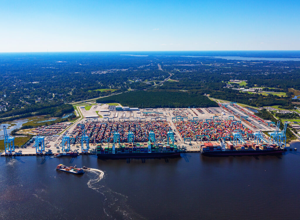 Aerial view of ship to shore stacking cranes, container yard, and berth at Virginia International Gateway at The Port of Virginia